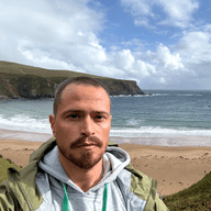 Photo of Russell Patrick Brown, a man with short hair and dark eyes