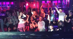 A lively group of dancers in vogue dancing poses